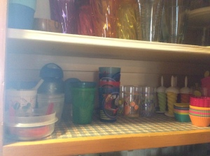 The sippy cup shelf: I hate this stuff. It takes over your world! And you get piles of lids and valves and straws. Thinned out some bottles I had been holding onto, and kept only the sippy cups and kid cups we use regularly. The boys mostly use Camelbak bottles that I don't keep here. 